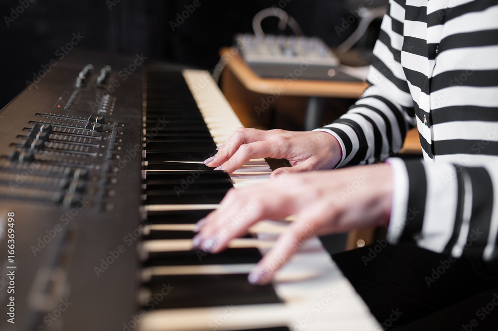Fototapeta premium Hands music, synthesizer, piano