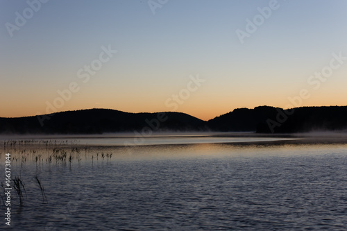 Mist at sunrise on Lake Ilay  in the French Jura