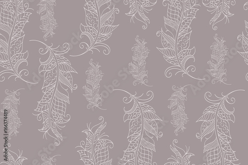 Seamless pattern with hand drawn feathers in mehndi style, vector. There is a swatch in the panel. Elements are not cut off and hidden under mask
