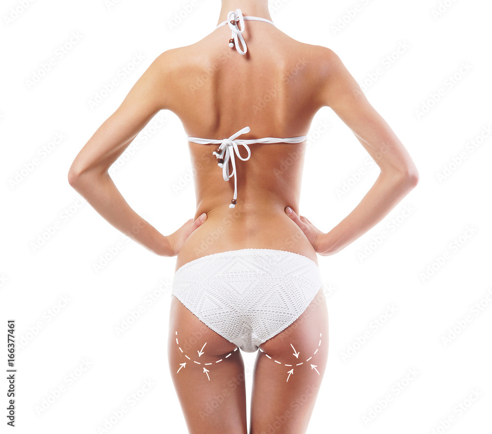 Slim body of a young and beautiful woman with arrows along her buttocks isolated on white Slim body of a young and beautiful woman with arrows along her buttocks isolated on white