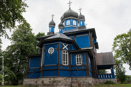 Building of the blue wooden antique orthodox church of Care of the Mother of God, Podlasie, Poland