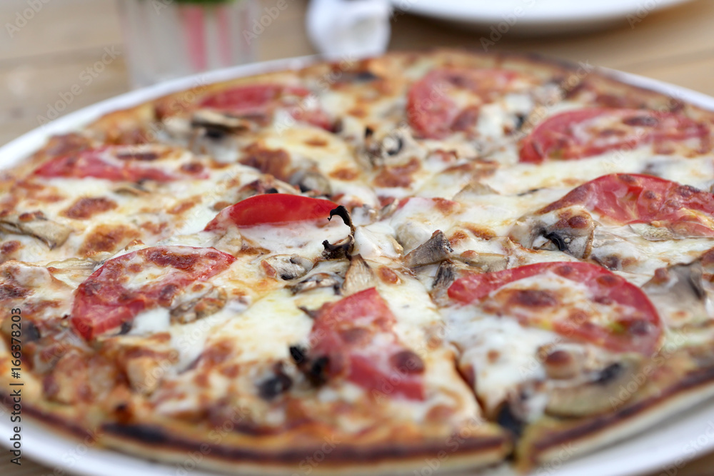 Pizza with mushrooms in cafe Pizza with mushrooms in cafe