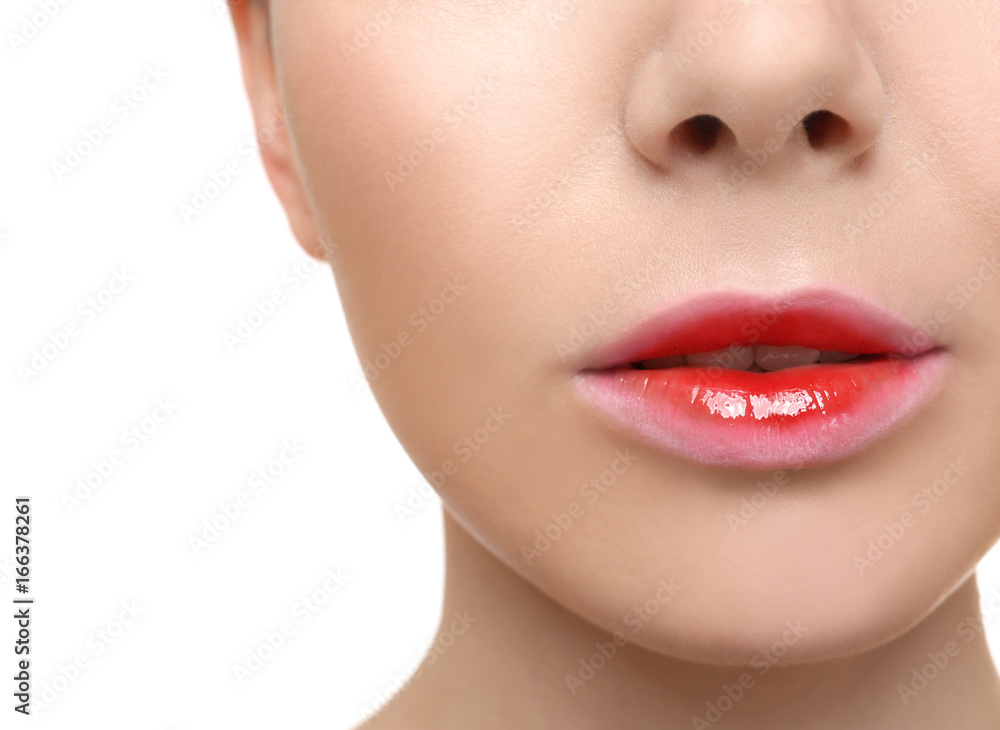 Young woman with beautiful lips on white background, closeup Young woman with beautiful lips on white background, closeup