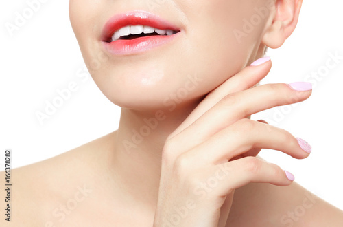 Young woman with beautiful lips on white background, closeup