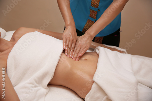 Young woman having massage in spa salon, closeup view © Africa Studio