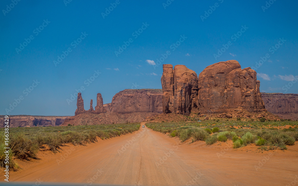 Sandy dirt road in the Valley of Monuments Sandy dirt road in the Valley of Monuments
