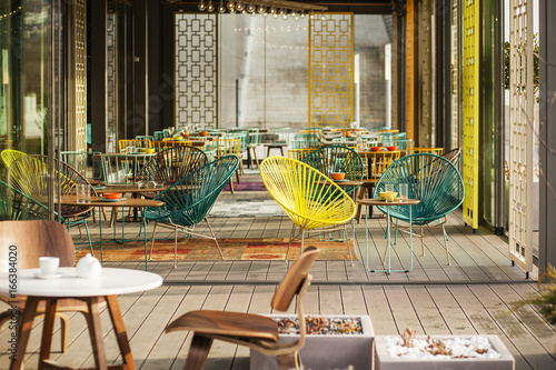 Exterior area of a nice cafe nicely lit by the morning sun