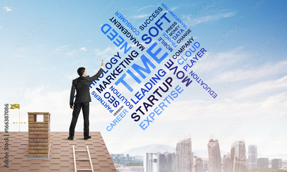 Young businessman standing on house roof and writing leadership skill concept. Mixed media Young businessman standing on house roof and writing leadership skill concept. Mixed media