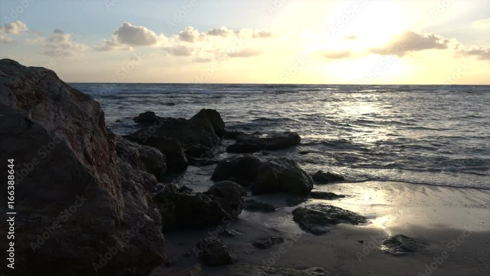 Slow Motion Waves Crashing Over Rocky Outcrop Slow Motion Waves Crashing Over Rocky Outcrop