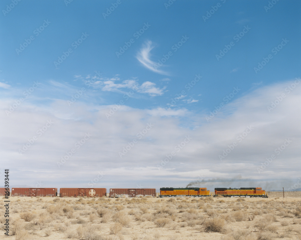 Train moving across sagebrush landscape, Nevada Train moving across sagebrush landscape, Nevada
