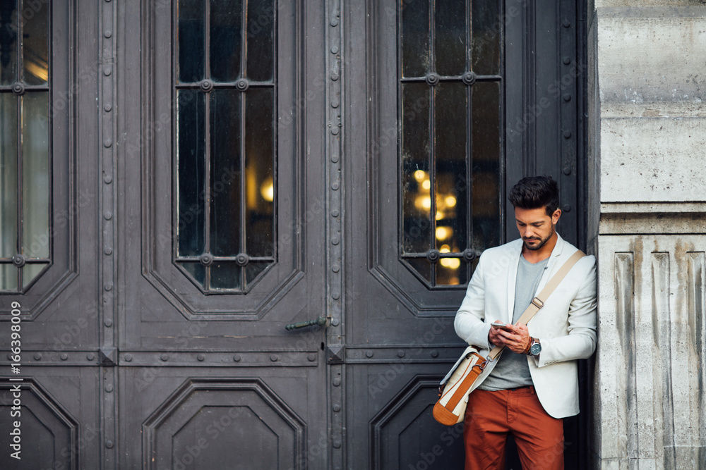 Handsome Man Texting on the Street Handsome Man Texting on the Street