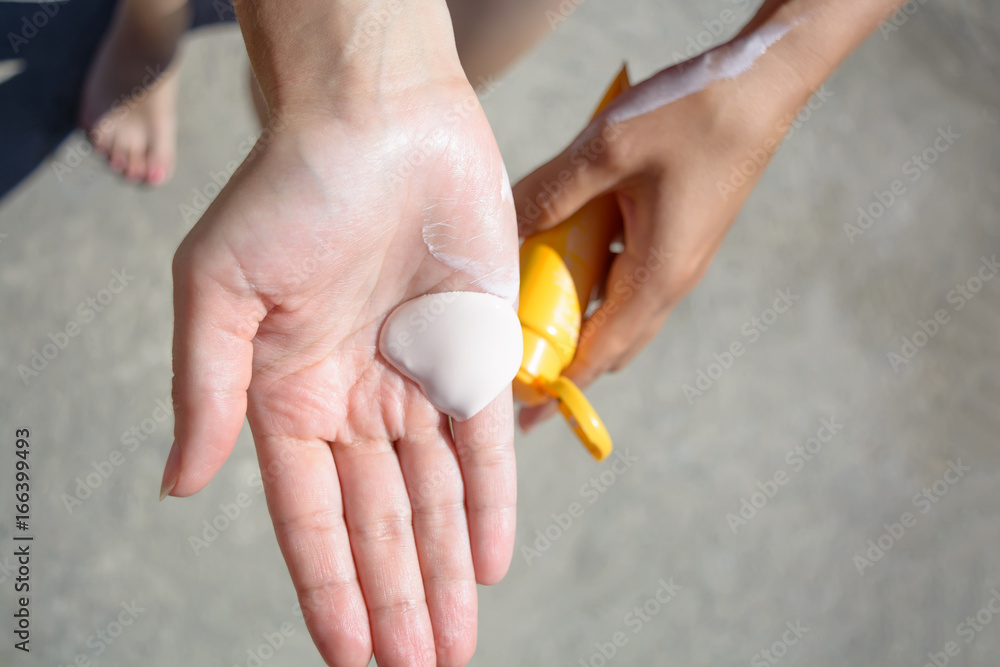 Female hands with sun protection cream. Skin care concept. Female hands with sun protection cream. Skin care concept.