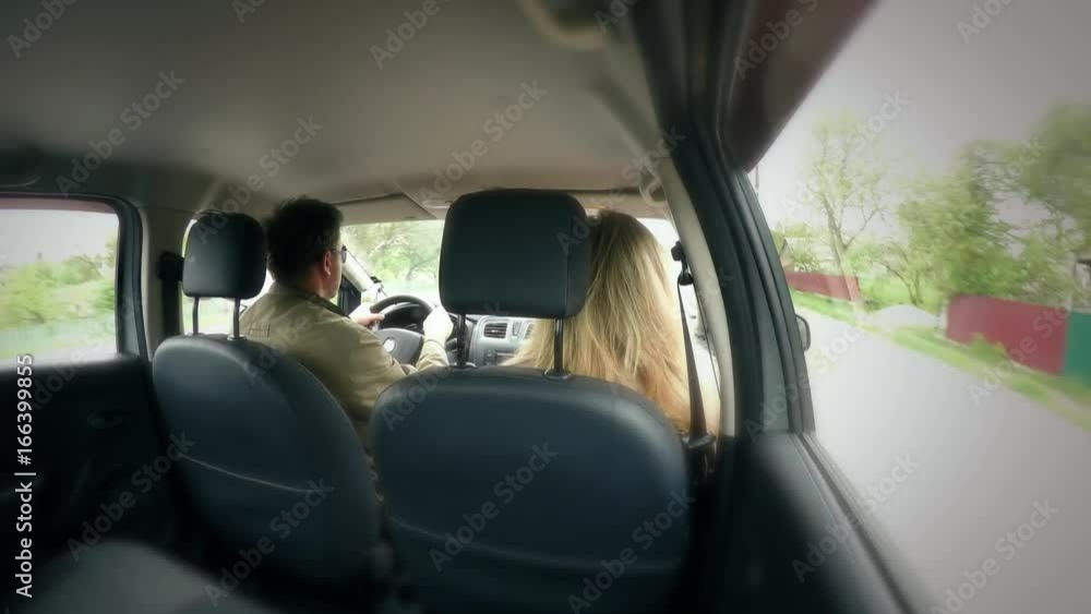 Travel, trip by car. Male driver and passenger female inside the car on the road. Traffic timelapse along the highway. High speed, road and roadside, oncoming cars. Vehicle hyperlapse
Travel, trip by car. Male driver and passenger female inside the car on the road. Traffic timelapse along the highway. High speed, road and roadside, oncoming cars. Vehicle hyperlapse
