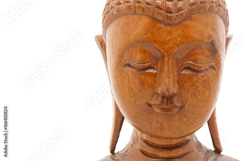 close-up Wooden buddha head, isolated on white background