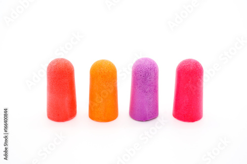 close-up ear plugs stoppers for protection against noise , isolated on a white background photo