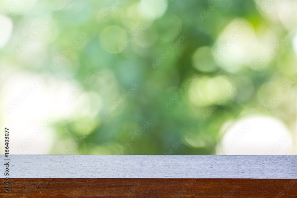 Wood table on the background blurred green nature. Wood table on the background blurred green nature.