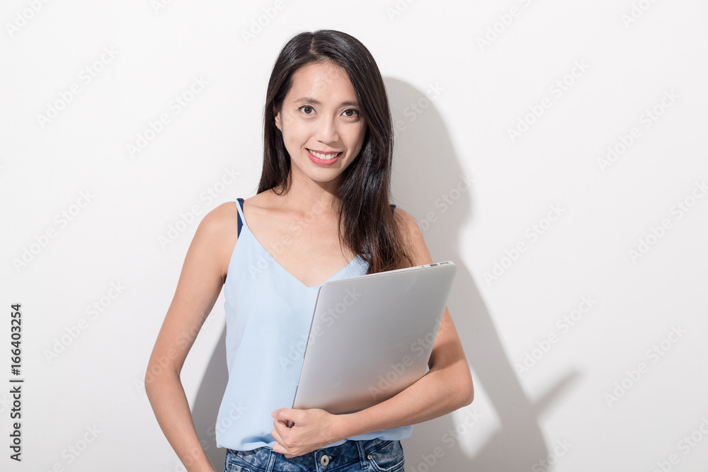 Woman holding laptop computer Woman holding laptop computer