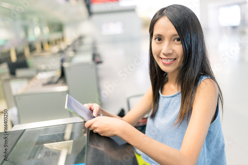Woman waiting for check in counter
