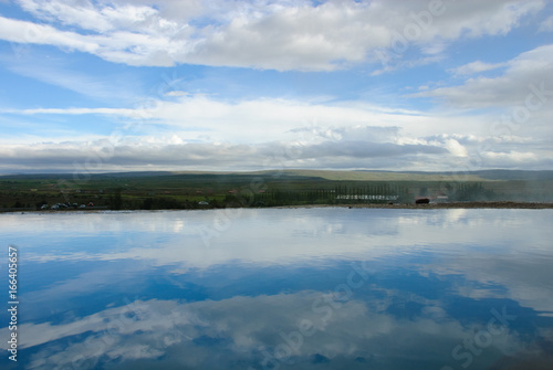 Still Lake Reflecting Clouds in Iceland