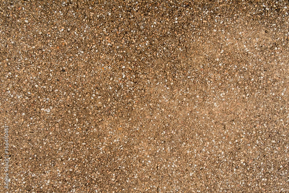 Brown small stone wall texture background, ground stone washed floor, made of small sand stone mixed Brown small stone wall texture background, ground stone washed floor, made of small sand stone mixed