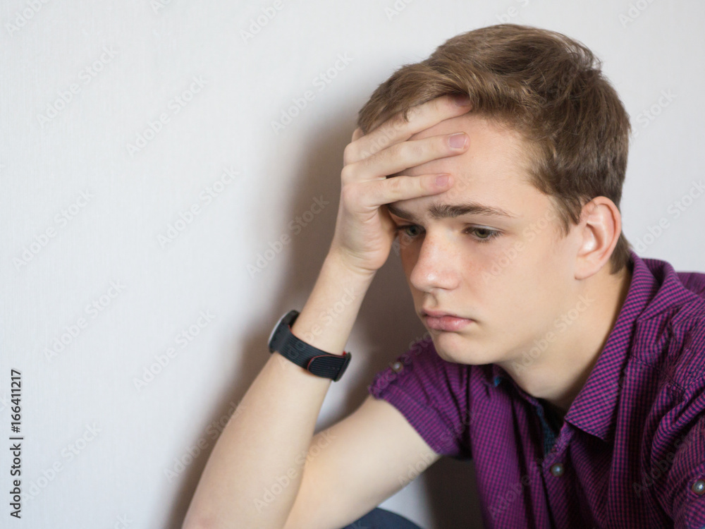 Portrait of a sad tired teenager