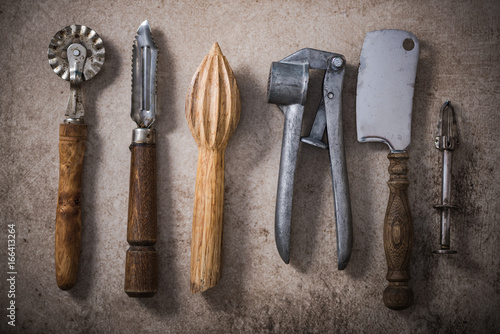 Vintage kitchen utensils on stone slate
