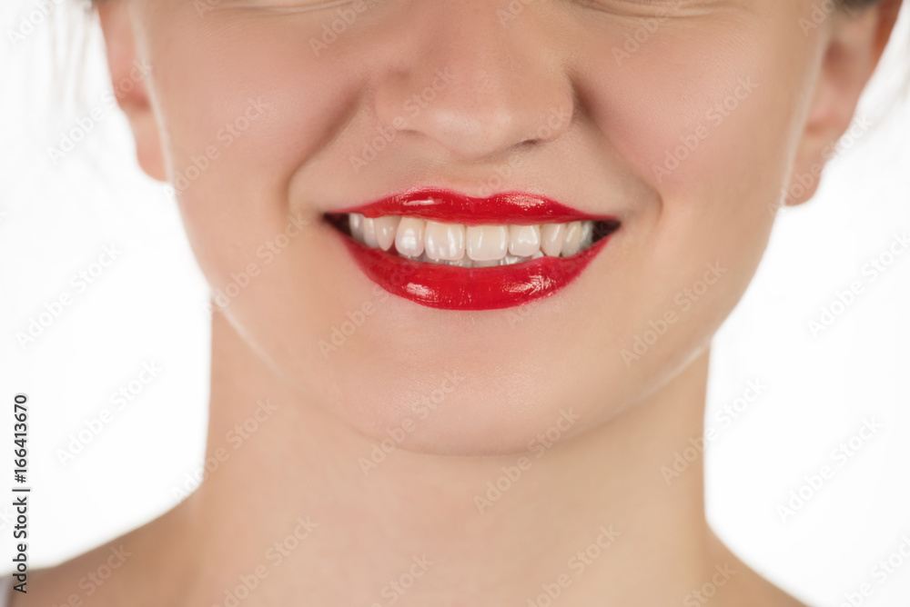 A beautiful young girl applies a persistent liquid red lipstick from a tube to her lips, and then takes it off as a film A beautiful young girl applies a persistent liquid red lipstick from a tube to her lips, and then takes it off as a film