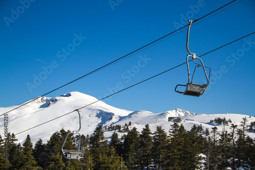 Skiers and snowboarders on a ski lift