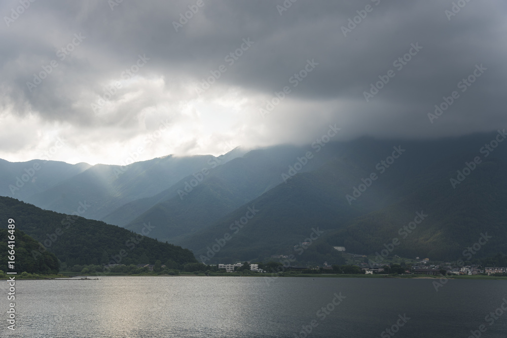 Lake Kawaguchi with sunset light and mountain background in Japan.