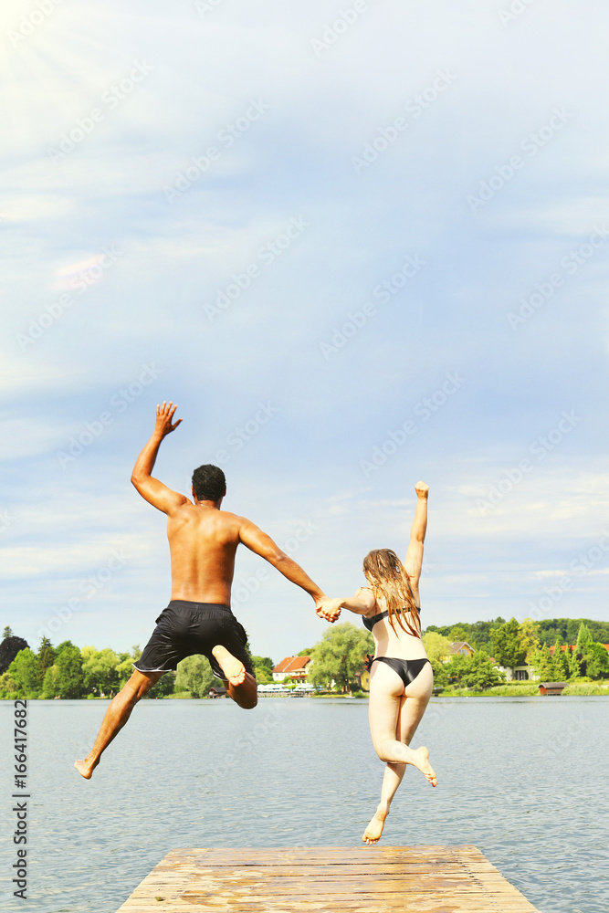 Couple Jumping Into Lake