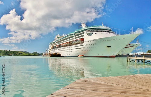 A cruise ship docked  on the tropical island of St. Johns, Antigua © crlocklear