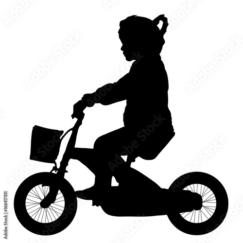 Child, girl is riding a baby bike silhouette, vector illustration side view photo