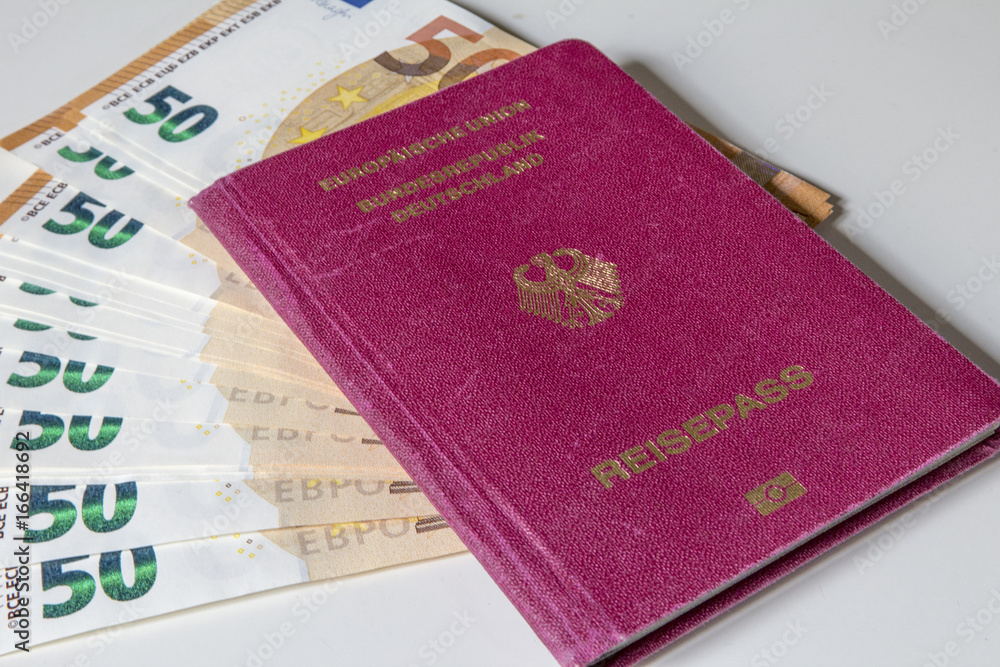German international traveling passport and euro money.