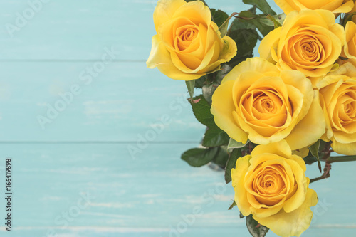Yellow Roses Bouquet on wood background