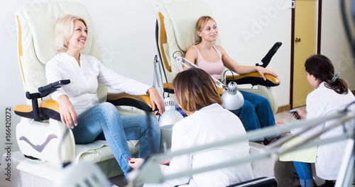 Women doing pedicure