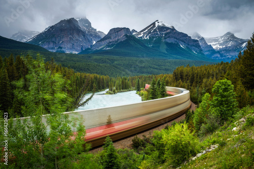 Train passing through Morant's Curve in bow valley, Banff National Park, Canada