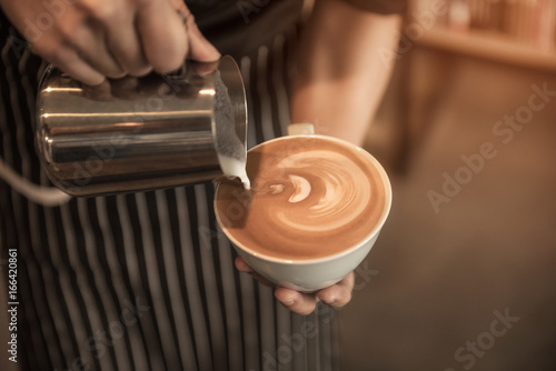 Cup of coffee latte in coffee shop Concept