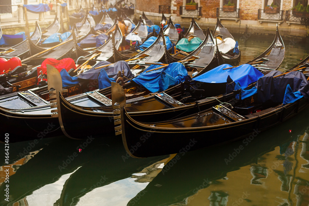 Gondolas parked near St. Marks Square of Venice, Italy