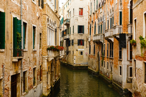 Narrow canals are famous and typical in Venice. © Angelov