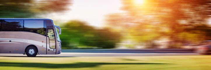 Bus on asphalt road in beautiful spring day at countryside