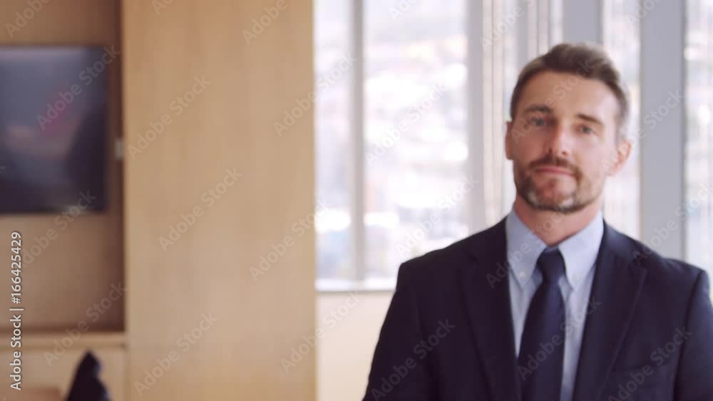 Portrait Of Businessman In Office Walking Towards Camera Portrait Of Businessman In Office Walking Towards Camera
