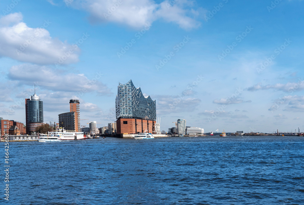 Fototapeta premium Hamburg harbor panorama with the river Elbe, Hafencity and the Elbphilharmonie opera house.