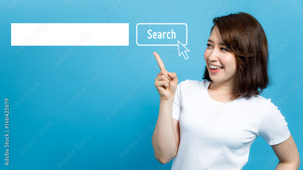young woman pointing at the search bar. - obrazy, fototapety, plakaty 