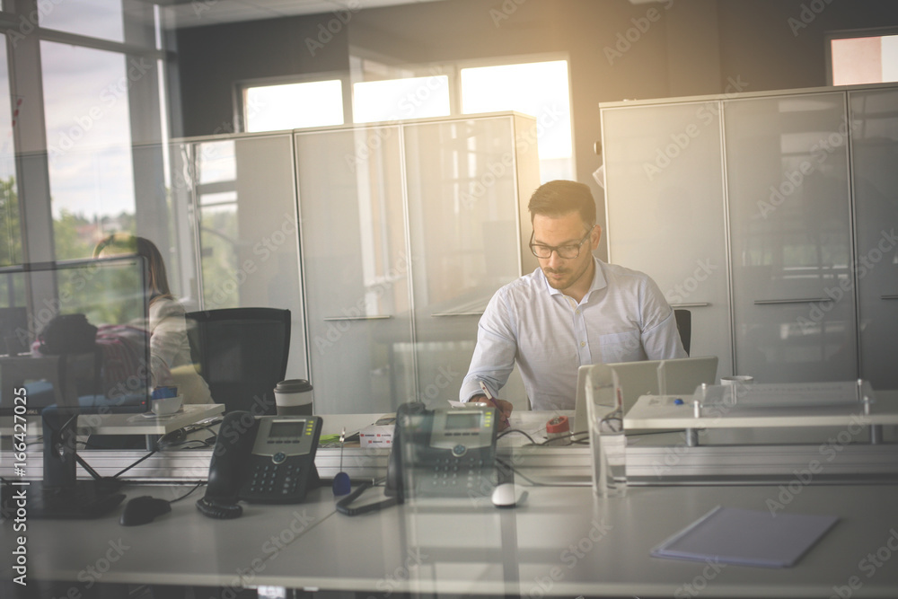 People in office working. Business man reading document. People in office working. Business man reading document.