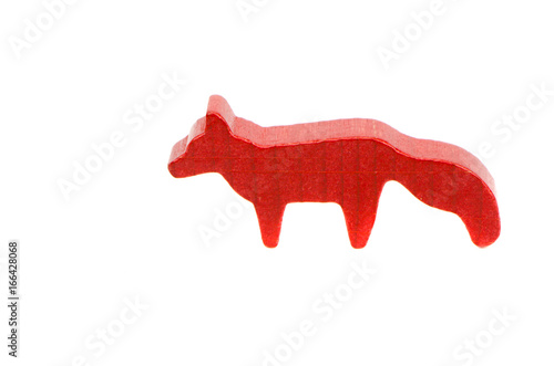 Small wooden red fox toy isolated on white