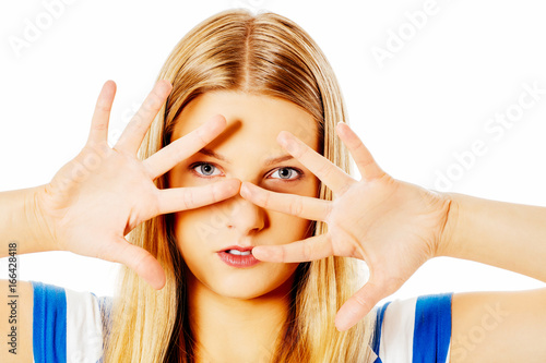 Woman covering her face with hands. photo