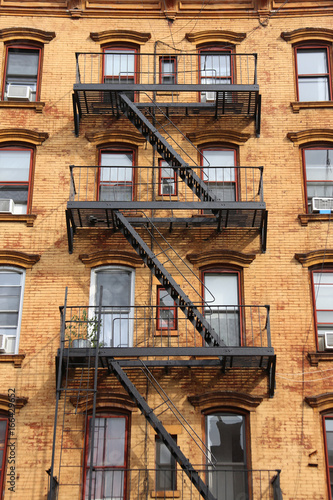 Wall of the house with fire stairs in downtown New York
