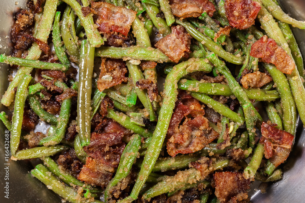 Close-up of healthy sauteed green beans with bacon, onion, and bread crumbs Close-up of healthy sauteed green beans with bacon, onion, and bread crumbs
