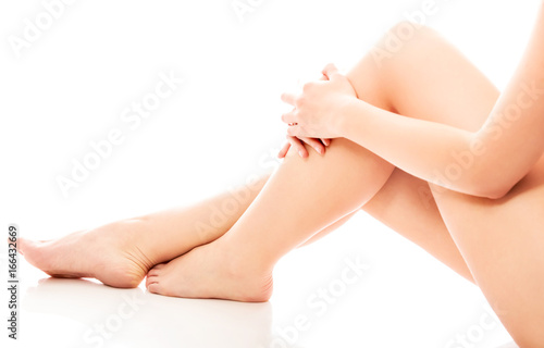 Women s feet on white background.