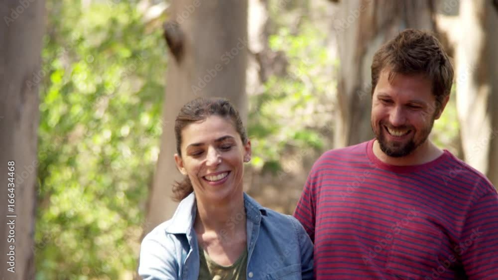 Romantic Couple Walking Along Forest Path Together Romantic Couple Walking Along Forest Path Together